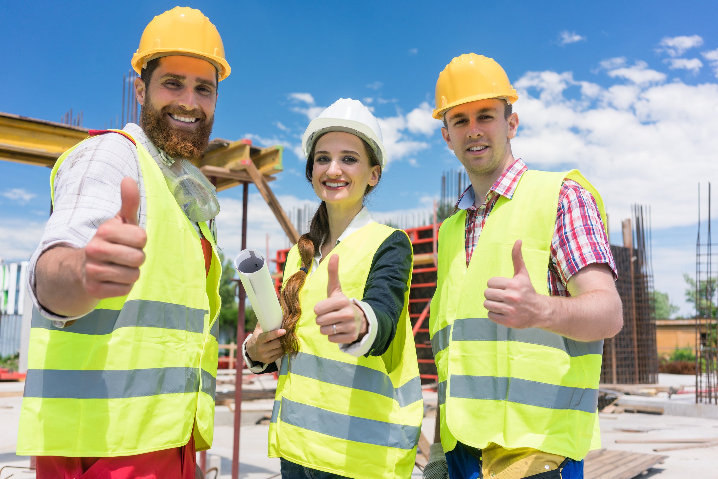 Three Colleagues in a Construction Team Showing Thumbs up